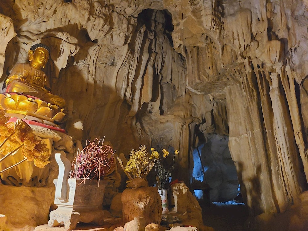Light streams through a natural skylight, illuminating the sacred altar inside